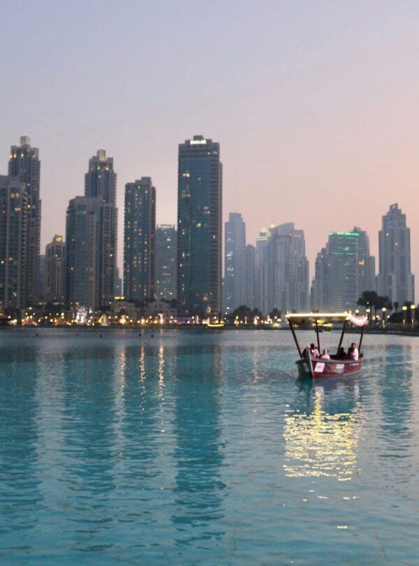 body of water with high-rise building in distance
