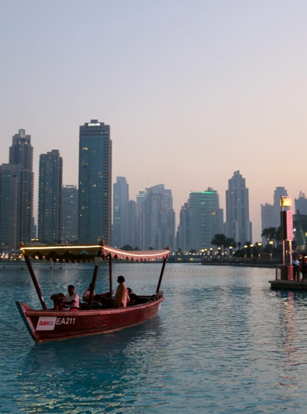 people riding on boat near dock