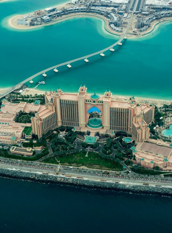 aerial photography of concrete buildings on the middle of the sea