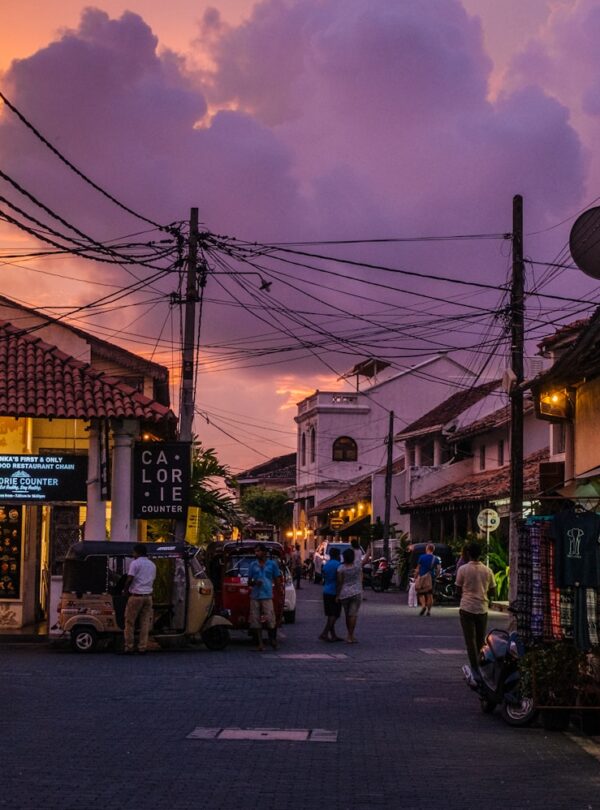 people gathering on street near house