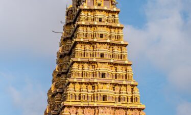 A tall tower with a clock on top of it