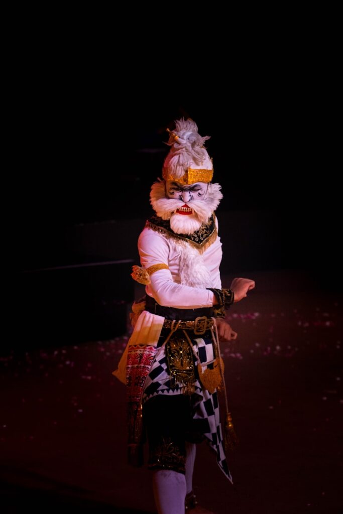 A person in a costume standing on a stage