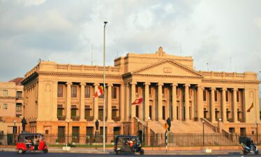 a building with flags on the roof