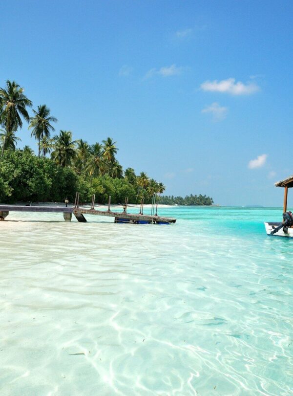 boat on body of water under cloudy sky