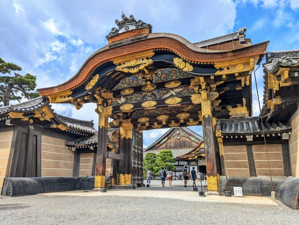 A large asian gate with a sky background