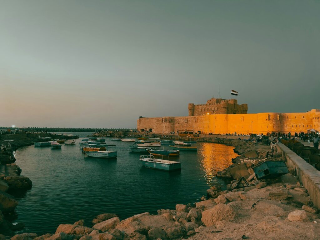 a group of boats floating on top of a body of water