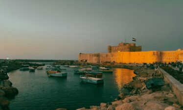 a group of boats floating on top of a body of water