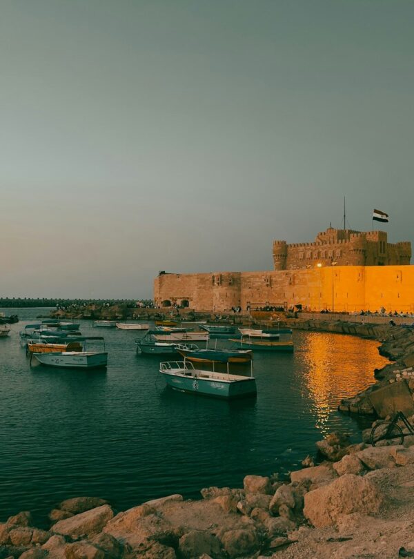 a group of boats floating on top of a body of water