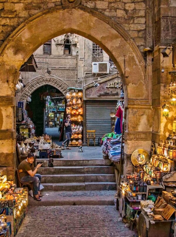 a narrow alley way with a lot of items on display
