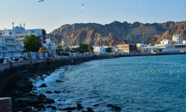 a body of water with a mountain in the background