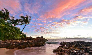 a beach that has some rocks in it