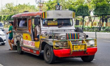 white and red truck on road during daytime