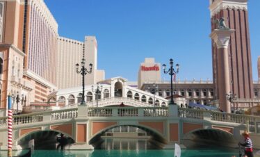 The Venetian Las Vegas over a river with a tower in the background