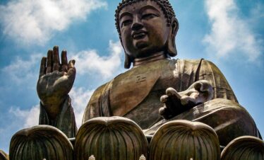 a large statue of a person holding a baby