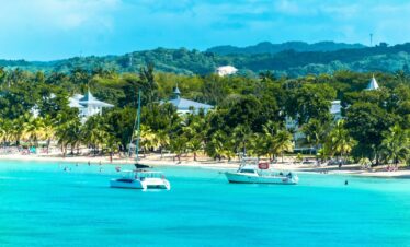 a group of boats floating on top of a body of water