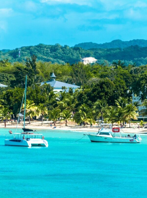 a group of boats floating on top of a body of water