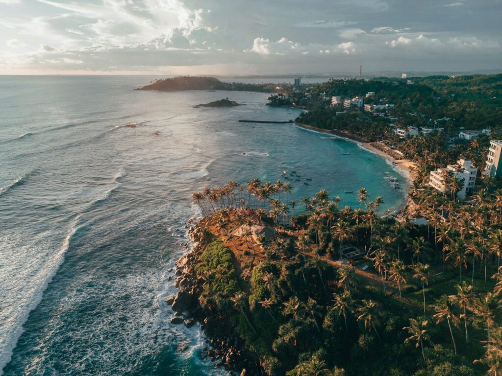 An aerial view of a tropical beach and ocean