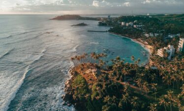 An aerial view of a tropical beach and ocean