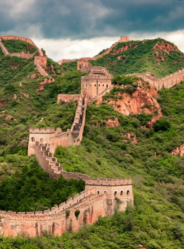 brown concrete building on top of hill