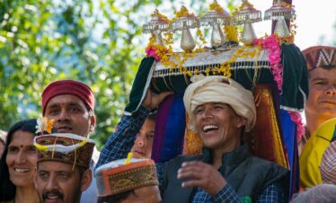 a group of people standing around each other