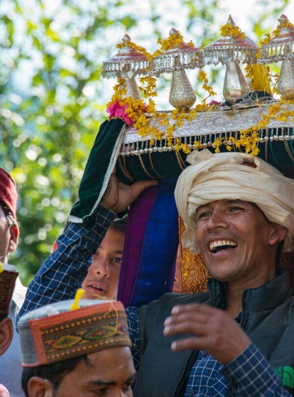 a group of people standing around each other