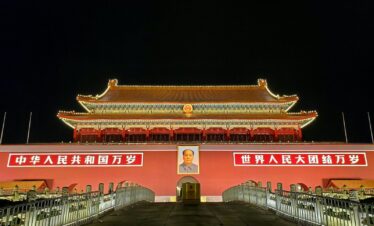 red and white concrete building during nighttime