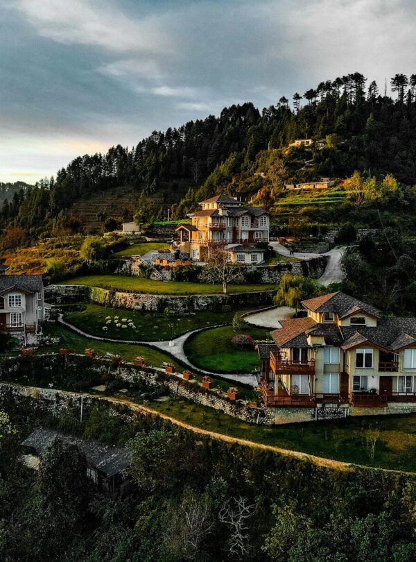 white and brown concrete house on hill