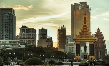a city with tall buildings and a clock tower