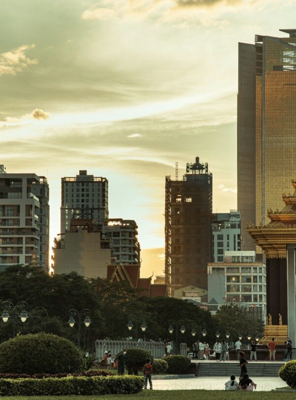 a city with tall buildings and a clock tower