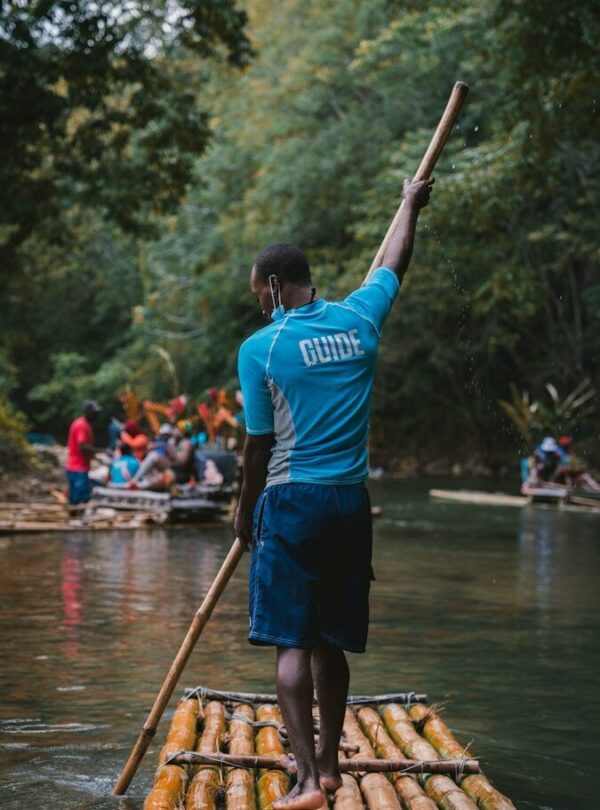 a person on a boat holding a paddle