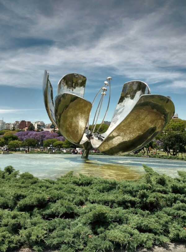 a large metal sculpture in the middle of a park