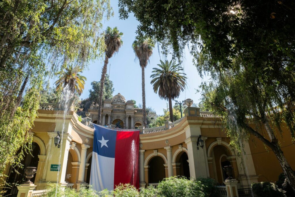 a large texas state flag hanging from the side of a building