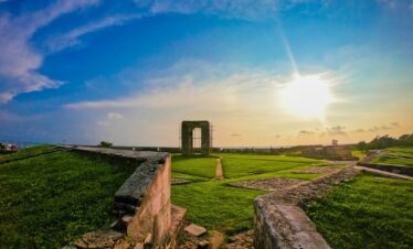 green grass field under blue sky during daytime