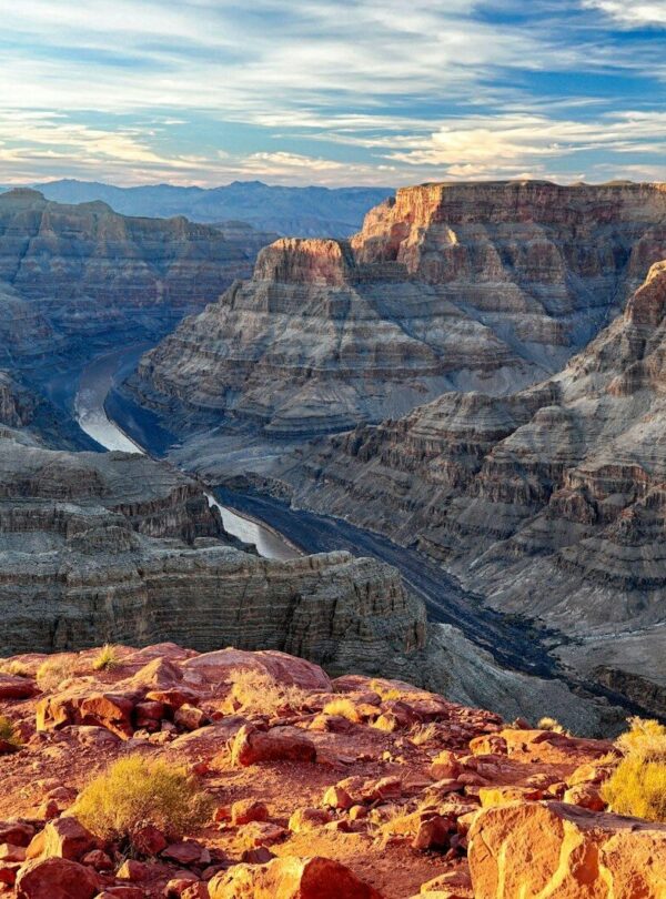 brown rocky mountain under white clouds during daytime