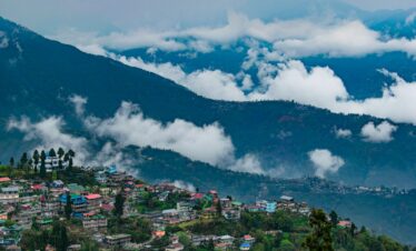 aerial view of city near mountain during daytime