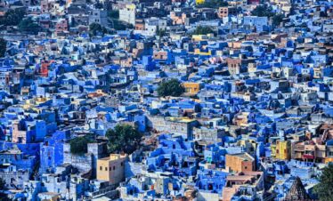 a large group of blue buildings in a city