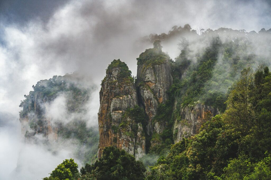 a mountain covered in fog and clouds