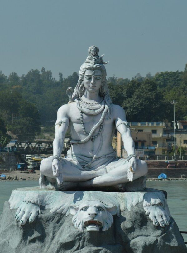 white statue of man on water fountain