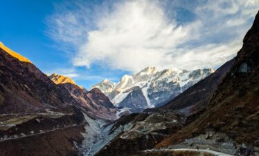 snow covered mountains under blue sky during daytime