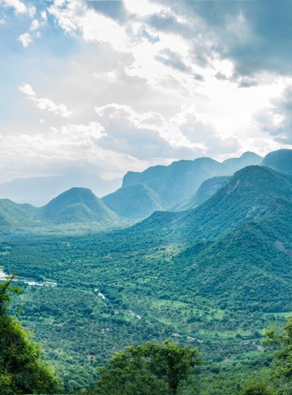 green mountains under white clouds during daytime