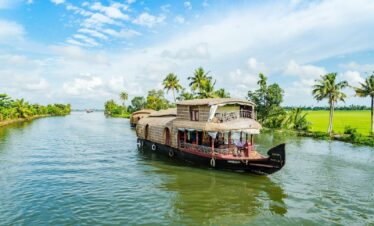 brown wooden boat on body of water during daytime