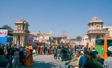 a crowd of people standing around a street