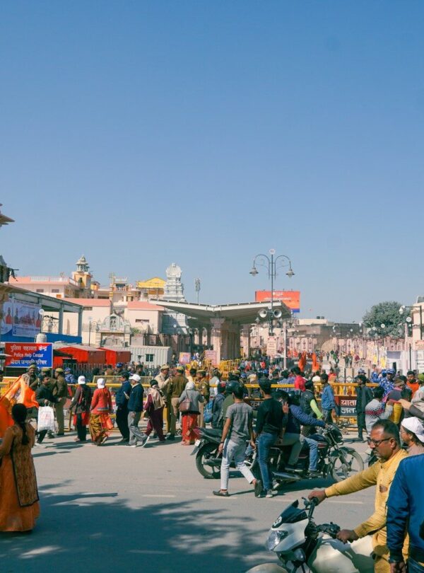 a crowd of people standing around a street
