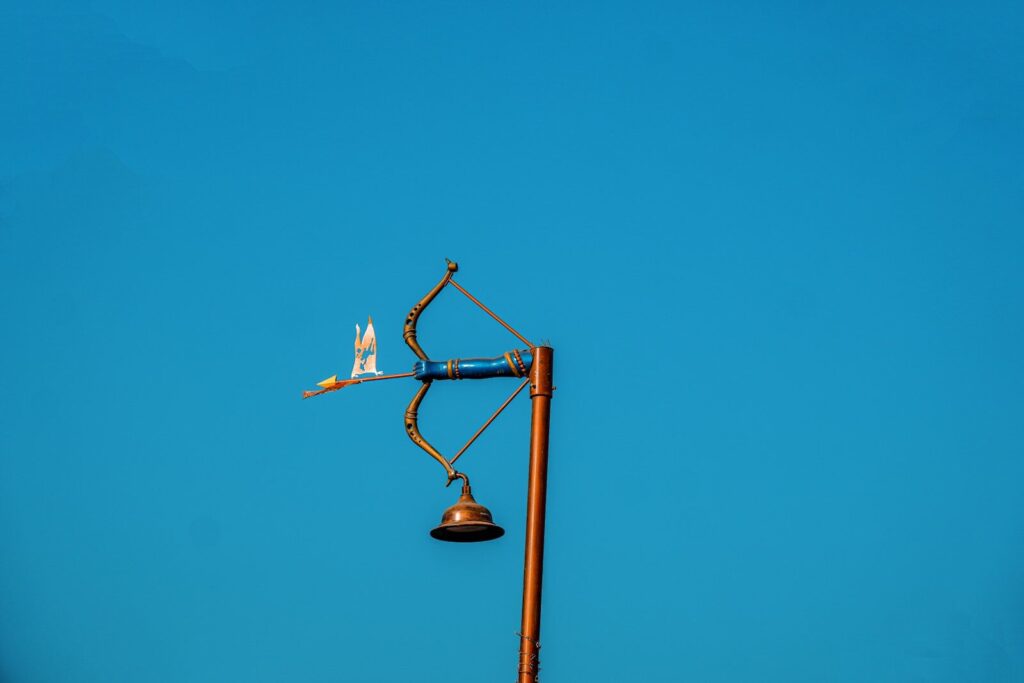 A street light with a blue sky in the background