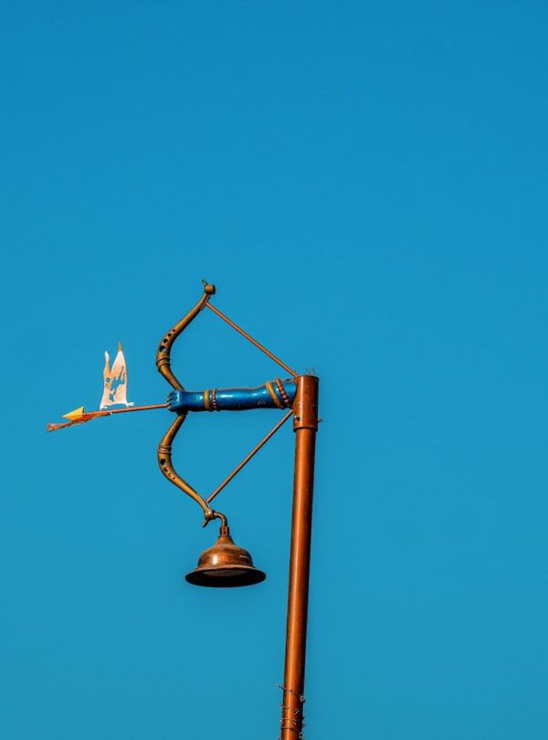 A street light with a blue sky in the background