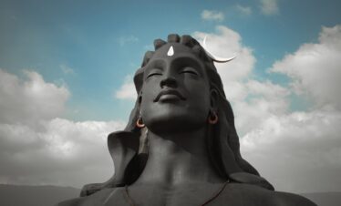 gray concrete statue under blue sky during daytime