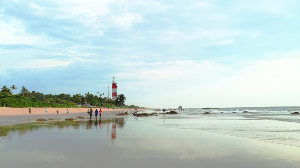 a group of people walking on a beach